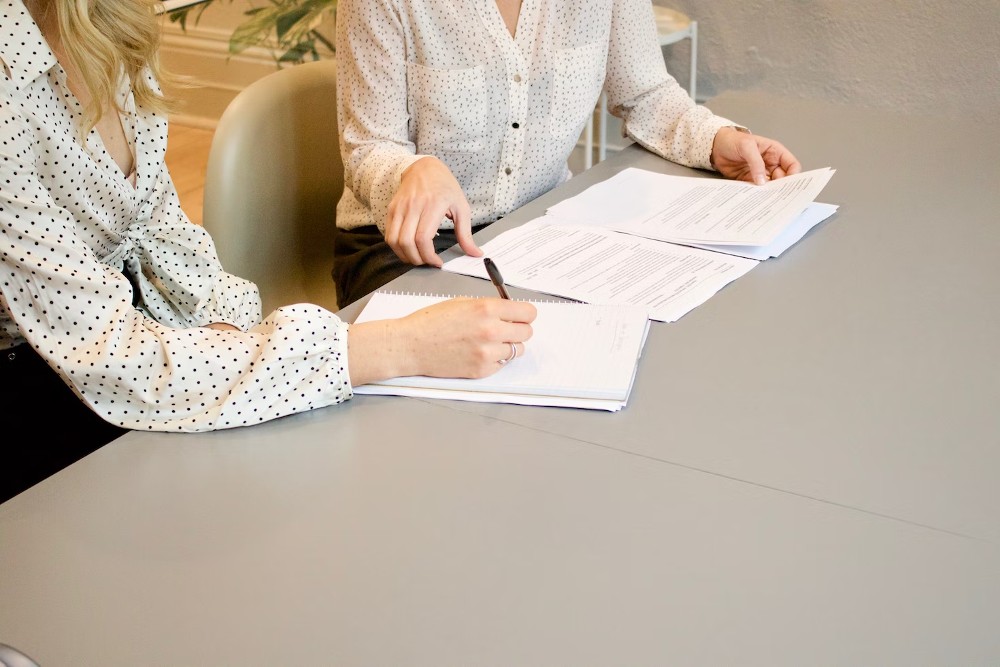 Women reading paperwork