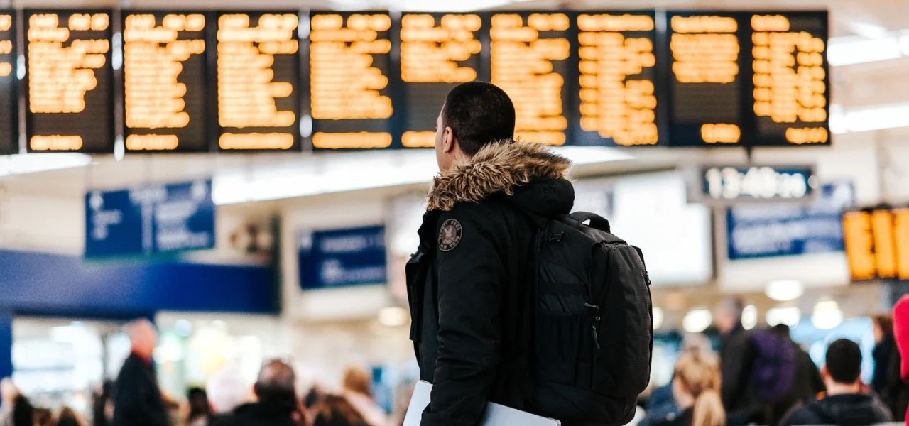 Man in front of departure times